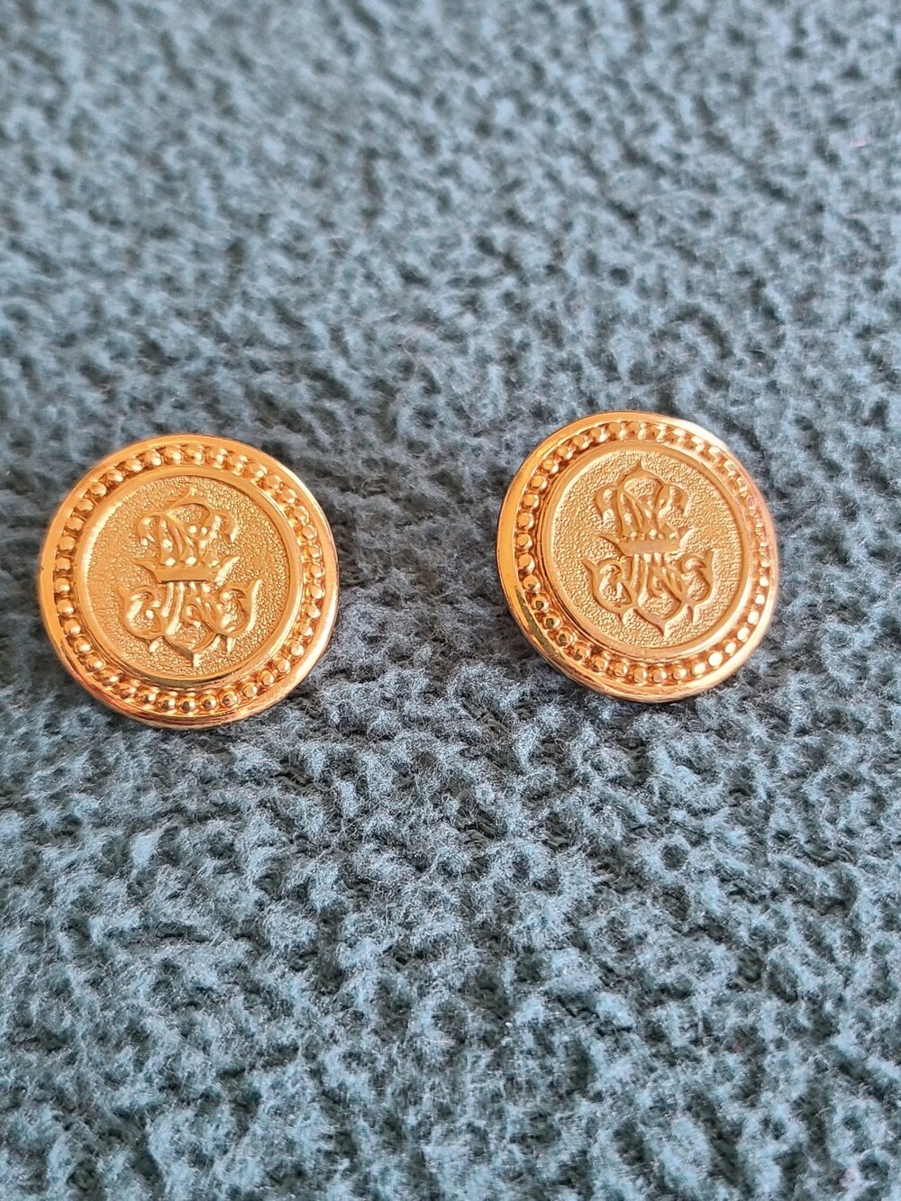 Vintage Monet Gold Round Embossed Crest Clip-On Earrings